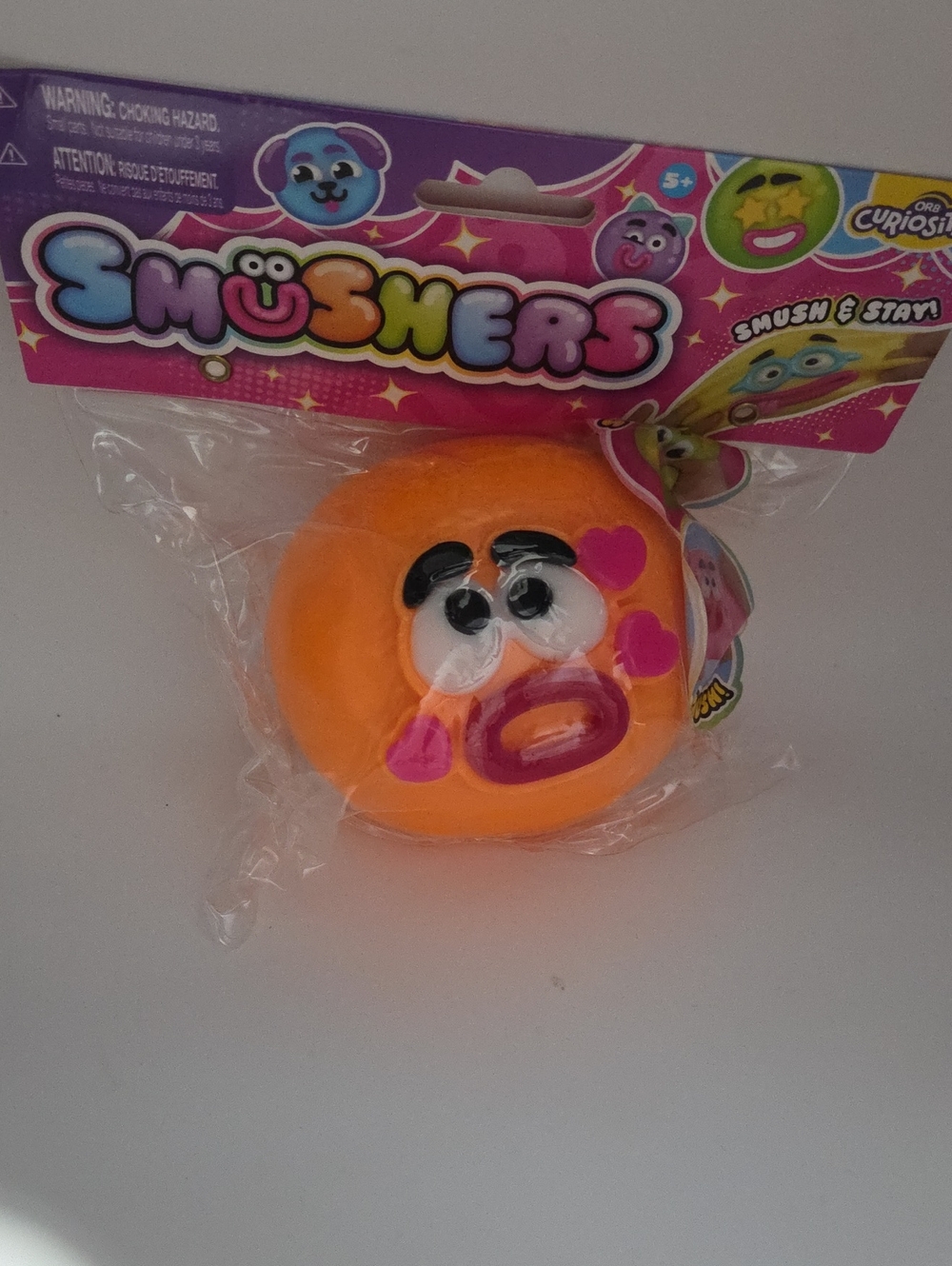 Usher Orange Emoji Squeeze Toy by Usher